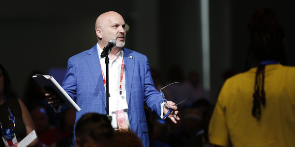 FEA President Andrew Spar introduces resolutions. FEA President Andrew Spar introduces resolutions.