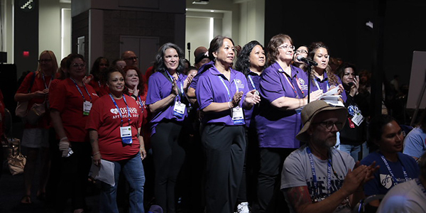 Group of women at a microphone