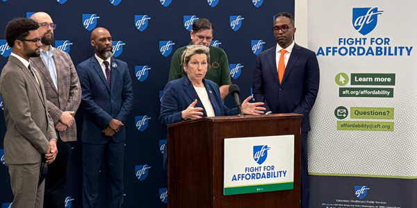A group of people speak at a podium. A group of people speak at a podium.
