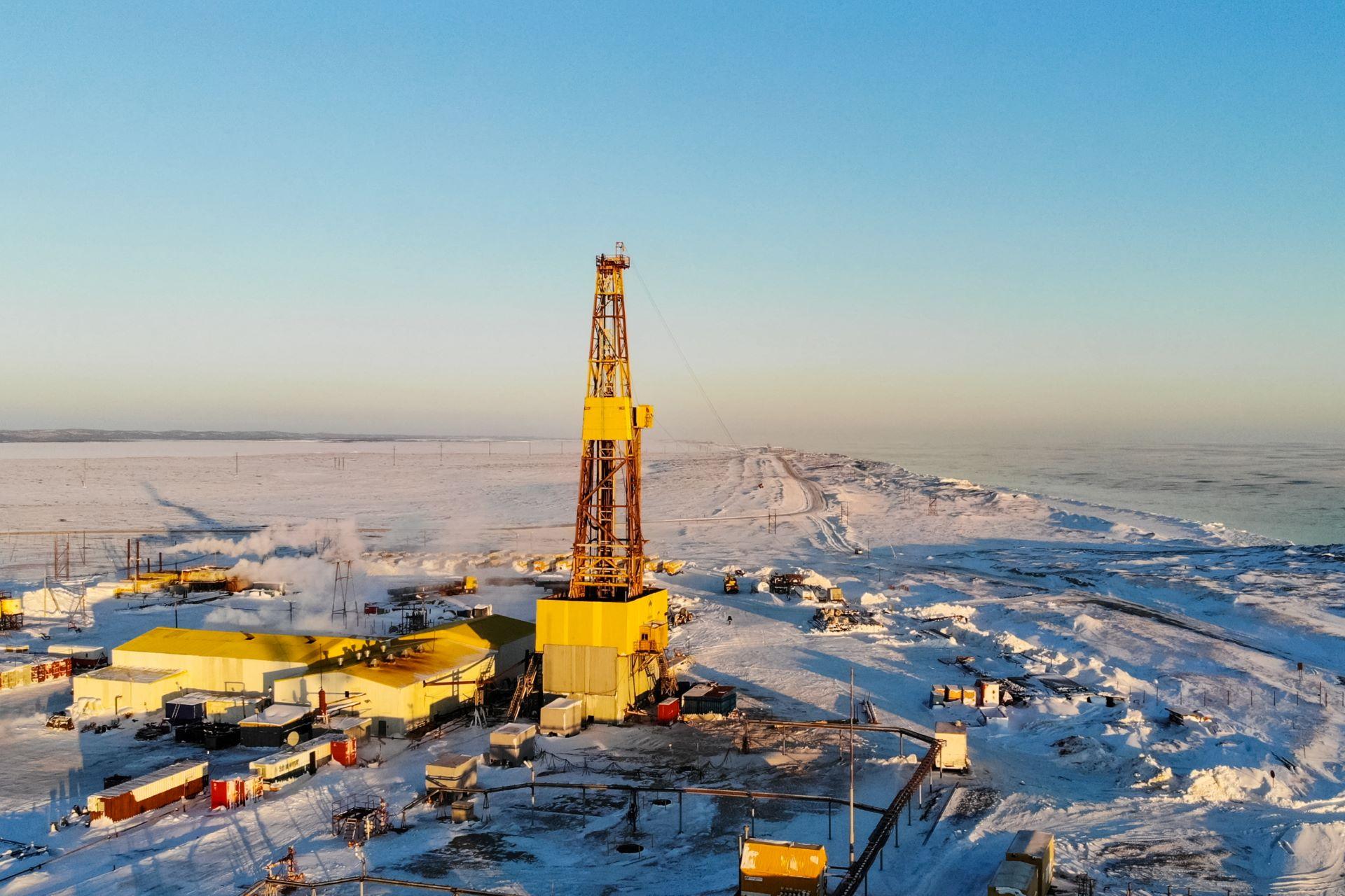 A drilling rig on Alaska's North Slope against a sunny sky 